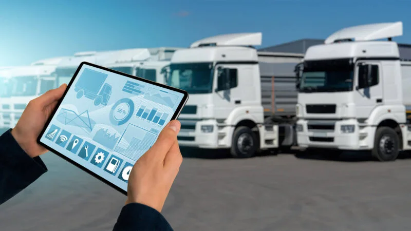 Fleet operator reviewing connected truck telemetry and route information
