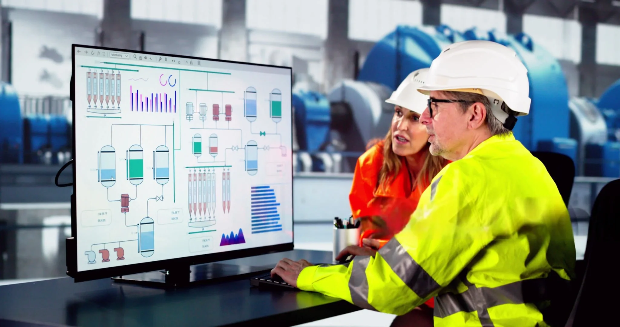 Industrial safety team reviewing live process and monitoring data