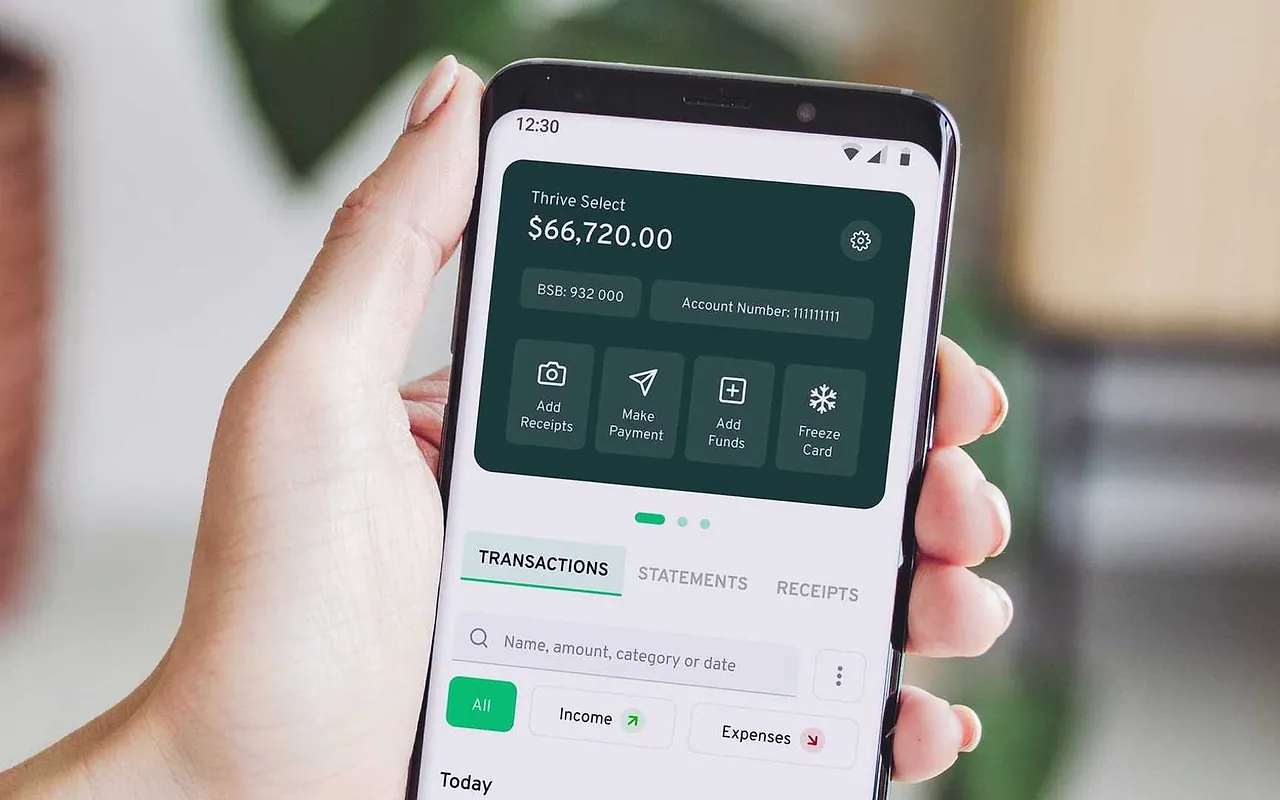 Professional reviewing an AI-assisted financial information application on a mobile phone