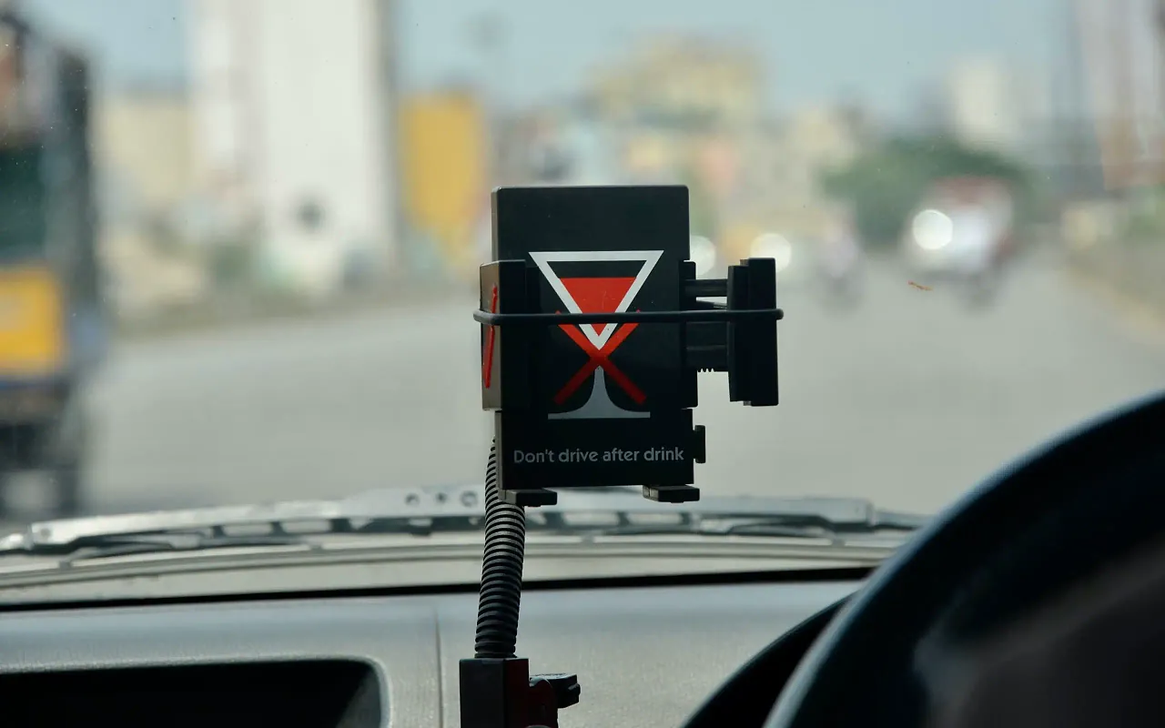 Compact connected vehicle safety device mounted inside a passenger vehicle