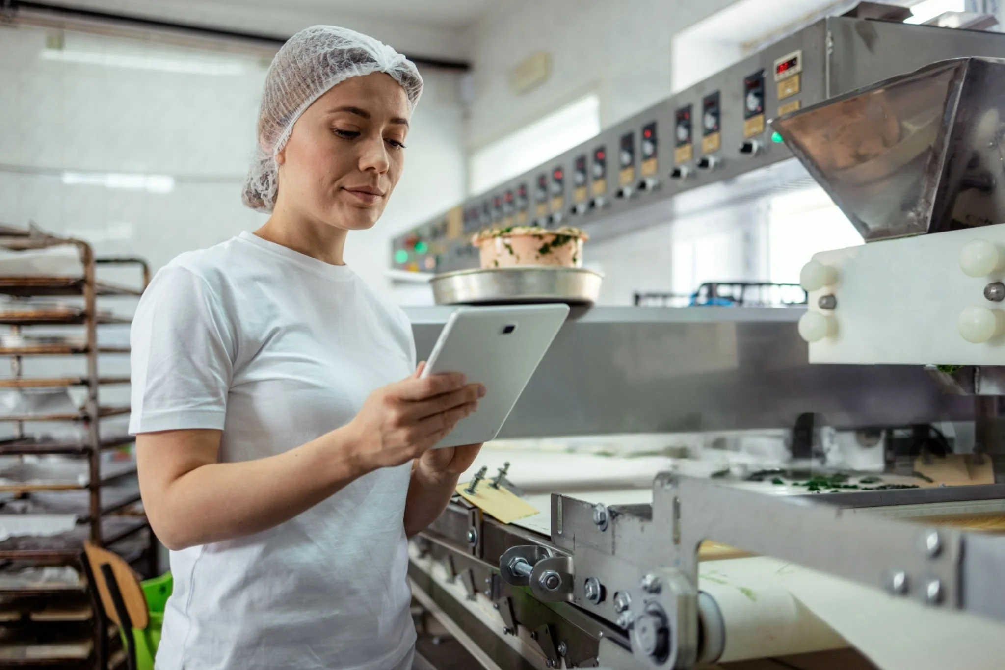 Commercial kitchen operator working with connected food production equipment